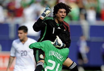 EAST RUTHERFORD, NJ - JULY 26:  Goalkeeper Guillermo Ochoa #1 and Juan Carlos Valenzuela #21 of Mexico celebrate 5-0 win over the United States in the CONCACAF Gold Cup Championship match at Giants Stadium on July 26, 2009 in East Rutherford, New Jersey.  (Photo by Jeff Zelevansky/Getty Images)