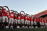 COLUMBUS, OH - OCTOBER 10:  The Ohio State Buckeyes sing their alma mater, Carmen Ohio, after defeating the Wisconsin Badgers 31-13 at Ohio Stadium on October 10, 2009 in Columbus, Ohio.  (Photo by Jamie Sabau/Getty Images)
