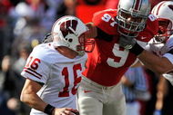 COLUMBUS, OH - OCTOBER 10: Cameron Heyward #97 of the Ohio State Buckeyes applies pressure to quarterback Scott Tolzien #16 of the Wisconsin Badgers at Ohio Stadium on October 10, 2009 in Columbus, Ohio. (Photo by Jamie Sabau/Getty Images)