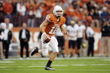 AUSTIN, TX - OCTOBER 10:  Quarterback Colt McCoy #12 of the Texas Longhorns looks for a receiver against the Colorado Buffaloes on October 10, 2009 at Darrell K Royal-Texas Memorial Stadium in Austin, Texas.  Texas won 38-14.  (Photo by Brian Bahr/Getty Images)