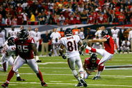 ATLANTA - OCTOBER 12:  Kicker Jason Elam #1 (R) of the Atlanta Falcons kicks the game-winning field goal with one second left over the Chicago Bears at the Georgia Dome on October 12, 2008 in Atlanta, Georgia.  (Photo by Kevin C. Cox/Getty Images)