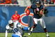 CHICAGO - OCTOBER 04: Johnny Knox #13 of the Chicago Bears runs past Ko Simpson #30 of the Detroit Lions on October 4, 2009 at Soldier Field in Chicago, Illinois. The Bears defeated the Lions 48-24. (Photo by Jonathan Daniel/Getty Images)