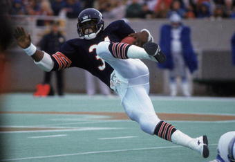Walter Payton #34 of the Chicago Bears carries the ball