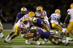 SEATTLE - SEPTEMBER 5:  Mason Foster #40 and Victor Aiyewa #41 of the Washington Huskies tackles Trindon Holliday #8 of the LSU Tigers on September 5, 2009 at Husky Stadium in Seattle, Washington. The LSU Tigers defeated the Washington Huskies 31-23. (Photo by Otto Greule Jr/Getty Images)