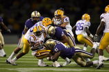 SEATTLE - SEPTEMBER 5:  Mason Foster #40 and Victor Aiyewa #41 of the Washington Huskies tackles Trindon Holliday #8 of the LSU Tigers on September 5, 2009 at Husky Stadium in Seattle, Washington. The LSU Tigers defeated the Washington Huskies 31-23. (Photo by Otto Greule Jr/Getty Images)