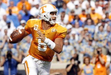 KNOXVILLE, TN - SEPTEMBER 12: Jonathan Crompton #8 of the Tennessee Volunteers scrambles against the UCLA Bruins on September 12, 2009 at Neyland Stadium in Knoxville, Tennessee. UCLA beat Tennessee 19-15. (Photo by Joe Murphy/Getty Images)