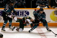SAN JOSE, CA - OCTOBER 10:  Patrick Marleau #12 and Manny Malhotra #27 of the San Jose Sharks and Martin Havlat #14 of the Minnesota Wild go for the puck at HP Pavilion on October 10, 2009 in San Jose, California.  (Photo by Ezra Shaw/Getty Images)