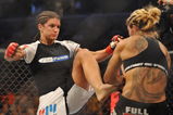SAN JOSE, CA - AUGUST 15:  Cris Cyborg (R) battles Gina Carano during their Middleweight Championship fight at Stikeforce: Carano vs. Cyborg on August 15, 2009 in San Jose, California.  (Photo by Jon Kopaloff/Getty Images)