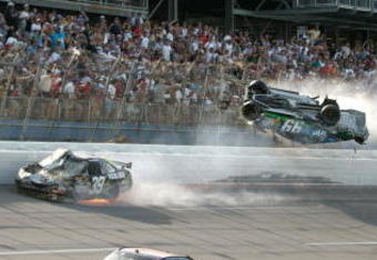 TALLADEGA, AL - APRIL 26:  Carl Edwards, driver of the #99 Claritin Ford, goes airborne as Ryan Newman, driver of the #39 Steweart-Haas Racing Chevrolet suffers damage and Dale Earnhardt Jr., driver of the #88 National Guard / AMP Energy Chevrolet drives at the conclusion of the NASCAR Sprint Cup Series Aaron's 499 at Talladega Superspeedway on April 26, 2009 in Talladega, Alabama.  (Photo by Jerry Markland/Getty Images for NASCAR)