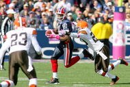 ORCHARD PARK, NY - OCTOBER 11: Terrell Owens #81 of the Buffalo Bills looks to run around Mike Adams #20 of the Cleveland Browns at Ralph Wilson Stadium on October 11, 2009 in Orchard Park, New York. (Photo by Rick Stewart/Getty Images)