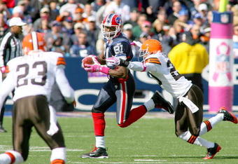 ORCHARD PARK, NY - OCTOBER 11: Terrell Owens #81 of the Buffalo Bills looks to run around Mike Adams #20 of the Cleveland Browns  at Ralph Wilson Stadium on October 11, 2009 in Orchard Park, New York.  (Photo by Rick Stewart/Getty Images)