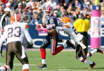 ORCHARD PARK, NY - OCTOBER 11: Terrell Owens #81 of the Buffalo Bills looks to run around Mike Adams #20 of the Cleveland Browns  at Ralph Wilson Stadium on October 11, 2009 in Orchard Park, New York.  (Photo by Rick Stewart/Getty Images)
