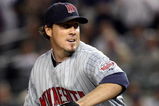 NEW YORK - OCTOBER 09:  Joe Nathan #36 of the Minnesota Twins pitches against the New York Yankees in Game Two of the ALDS during the 2009 MLB Playoffs at Yankee Stadium on October 9, 2009 in the Bronx borough of New York City.  (Photo by Jim McIsaac/Getty Images)