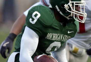 EAST LANSING, MI - OCTOBER 14:  Demond Williams #9 of the Michigan State Spartans tries to get around the tackle of Ross Homan #51 of the Ohio State Buckeys during second quarter action on October 14, 2006 at Spartan Stadium in East Lansing, Michigan. Ohio State won the game 38-7.  (Photo by Gregory Shamus/Getty Images)