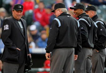 DENVER - APRIL 11:  (L-R) Umpire crew chief Gerry Davis prepares to oversee homeplate as his crew Brian Gorman, CB Bucknor and Mike Everitt prepare to take the field as the Philadelphia Phillies face the Colorado Rockies during MLB action at Coors Field on April 11, 2009 in Denver, Colorado. The Phillies defeated the Rockies 8-4.  (Photo by Doug Pensinger/Getty Images)