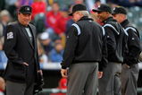 DENVER - APRIL 11:  (L-R) Umpire crew chief Gerry Davis prepares to oversee homeplate as his crew Brian Gorman, CB Bucknor and Mike Everitt prepare to take the field as the Philadelphia Phillies face the Colorado Rockies during MLB action at Coors Field on April 11, 2009 in Denver, Colorado. The Phillies defeated the Rockies 8-4.  (Photo by Doug Pensinger/Getty Images)