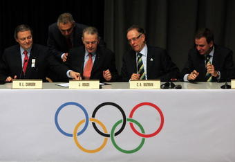 COPENHAGEN, DENMARK - OCTOBER 02:  IOC President Jacques Rogge (2L) and Rio de Janeiro bid leader Carlos Nuzman prepare to sign the Host City contract during a press conference after Rio De Janeiro won the vote to stage the 2016 Olympic Games at the Bella Centre on October 2, 2009 in Copenhagen, Denmark. After eliminating Chicago, Tokyo and Madrid, International Olympic Committee members selected the Brazilian city as site of the 2016 Summer Games. This will be the first time the Olympics will be held in South America.  (Photo by Peter Macdiarmid/Getty Images)