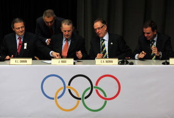 COPENHAGEN, DENMARK - OCTOBER 02:  IOC President Jacques Rogge (2L) and Rio de Janeiro bid leader Carlos Nuzman prepare to sign the Host City contract during a press conference after Rio De Janeiro won the vote to stage the 2016 Olympic Games at the Bella Centre on October 2, 2009 in Copenhagen, Denmark. After eliminating Chicago, Tokyo and Madrid, International Olympic Committee members selected the Brazilian city as site of the 2016 Summer Games. This will be the first time the Olympics will be held in South America.  (Photo by Peter Macdiarmid/Getty Images)