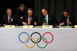COPENHAGEN, DENMARK - OCTOBER 02:  IOC President Jacques Rogge (2L) and Rio de Janeiro bid leader Carlos Nuzman prepare to sign the Host City contract during a press conference after Rio De Janeiro won the vote to stage the 2016 Olympic Games at the Bella Centre on October 2, 2009 in Copenhagen, Denmark. After eliminating Chicago, Tokyo and Madrid, International Olympic Committee members selected the Brazilian city as site of the 2016 Summer Games. This will be the first time the Olympics will be held in South America.  (Photo by Peter Macdiarmid/Getty Images)
