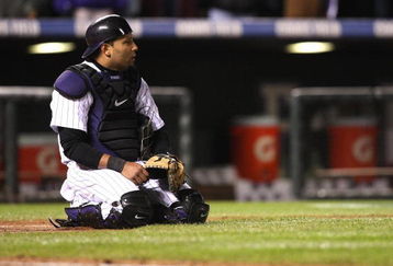 DENVER - OCTOBER 12: Yorvit Torrealba #8 of the Colorado Rockies looks on in the ninth inning against the Philadelphia Phillies in Game Four of the NLDS during the 2009 MLB Playoffs at Coors Field on October 12, 2009 in Denver, Colorado.  (Photo by Jed Jacobsohn/Getty Images)