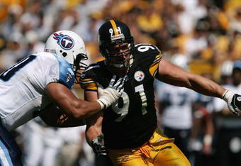 PITTSBURGH - SEPTEMBER 11:  Defensive end Aaron Smith #91 of the Pittsburgh Steelers tries to get around tackle Jacob Bell #60 of the Tennessee Titans during a game at Heinz Field on September 11, 2005 in Pittsburgh, Pennsylvania.  The Steelers defeated the Titans 34-7. (Photo by Jonathan Daniel/Getty Images)