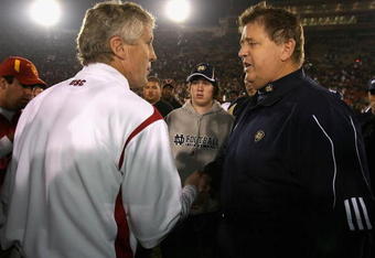 LOS ANGELES, CA - NOVEMBER 29:  Head coach Charlie Weis of the Notre Dame Fighting Irish greets Pete Carroll of the USC Trojans after the game at Los Angeles Memorial Coliseum on November 29, 2008 in Los Angeles, California. The Trojans defeated the Fighting Irish 38-3.  (Photo by Christian Petersen/Getty Images)