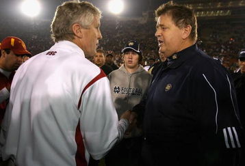 LOS ANGELES, CA - NOVEMBER 29:  Head coach Charlie Weis of the Notre Dame Fighting Irish greets Pete Carroll of the USC Trojans after the game at Los Angeles Memorial Coliseum on November 29, 2008 in Los Angeles, California. The Trojans defeated the Fighting Irish 38-3.  (Photo by Christian Petersen/Getty Images)