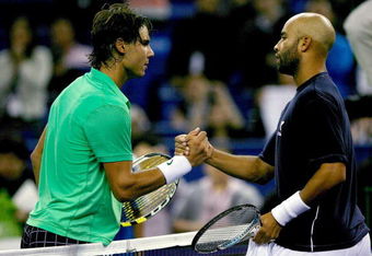 SHANGHAI, CHINA - OCTOBER 14:  Rafael Nadal of Spain is congratulated by James Blake of the United States after their match during the 2009 Shanghai ATP Masters 1000 at Qi Zhong Tennis Centre on October 14, 2009 in Shanghai, China.  (Photo by Matthew Stockman/Getty Images)