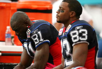 MIAMI - OCTOBER 04:  Wide receivers Terrell Owens #81 and Lee Evans #83 of the Buffalo Bills react on the bench late in the fourth quarter against the Miami Dolphins at Land Shark Stadium on October 4, 2009 in Miami, Florida. The Dolphins defeated the Bills 38-10.  (Photo by Doug Benc/Getty Images)