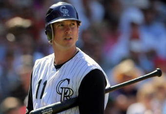 DENVER - AUGUST 27:  Brad Hawpe #11 of the Colorado Rockies heads to the dugout after being called out on strikes in the sixth inning against the Los Angeles Dodgers at Coors Field on August 27, 2009 in Denver, Colorado. The Dodgers defeated the Rockies 3-2.  (Photo by Doug Pensinger/Getty Images)
