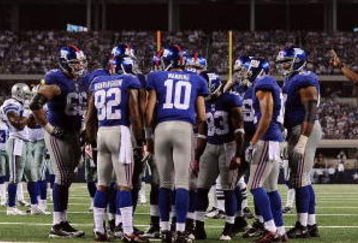 ARLINGTON, TX - SEPTEMBER 20:  The New York Giants huddle up during play against the Dallas Cowboys at Cowboys Stadium on September 20, 2009 in Arlington, Texas.  (Photo by Ronald Martinez/Getty Images)