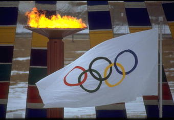 13 FEB 1988:  THE OLYMPIC FLAME AND FLAG CAN BE SEEN DURING THE OPENING CEREMONY OF THE 1988 WINTER OLYMPICS HELD IN CALGARY IN CANADA.