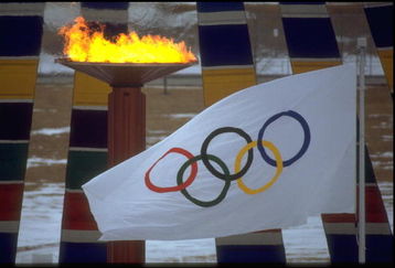 13 FEB 1988:  THE OLYMPIC FLAME AND FLAG CAN BE SEEN DURING THE OPENING CEREMONY OF THE 1988 WINTER OLYMPICS HELD IN CALGARY IN CANADA.