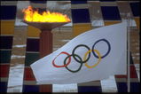 13 FEB 1988:  THE OLYMPIC FLAME AND FLAG CAN BE SEEN DURING THE OPENING CEREMONY OF THE 1988 WINTER OLYMPICS HELD IN CALGARY IN CANADA.