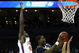 KANSAS CITY, MO - MARCH 19: Manny Harris #3 of the Michigan Wolverines jumps to the basket for a scoring attempt against Tanner Smith #5 of the Clemson Tigers during the first round of the NCAA Division I Men's Basketball Tournament at the Sprint Center on March 19, 2009 in Kansas City, Missouri. (Photo by Jamie Squire/Getty Images)