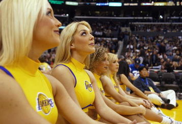 LOS ANGELES - FEBRUARY 11:  The Los Angeles Lakers cheerleaders look on during the game against the Denver Nuggets at Staples Center on February 11, 2003 in Los Angeles, California.  The Lakers won 121-93.  NOTE TO USER:  User expressly acknowledges and agrees that, by downloading and or using this photograph, user is consenting to the terms and conditions of the Getty Images license agreement. (Photo by Lisa Blumenfeld/Getty Images)