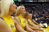 LOS ANGELES - FEBRUARY 11:  The Los Angeles Lakers cheerleaders look on during the game against the Denver Nuggets at Staples Center on February 11, 2003 in Los Angeles, California.  The Lakers won 121-93.  NOTE TO USER:  User expressly acknowledges and agrees that, by downloading and or using this photograph, user is consenting to the terms and conditions of the Getty Images license agreement. (Photo by Lisa Blumenfeld/Getty Images)