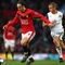 MANCHESTER, ENGLAND - OCTOBER 03:  Dimitar Berbatov of Manchester United holds off Lee Cattermole of Sunderland during the Barclays Premier League match between Manchester United and Sunderland at Old Trafford on October 3, 2009 in Manchester, England. (Photo by Clive Brunskill/Getty Images)