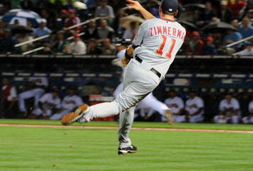 ATLANTA - APRIL 10: Third baseman Ryan Zimmerman #11 of the Washington Nationals fields a short hit and throws to first base for an out against the Atlanta Braves April 10, 2009 at Turner Field in Atlanta, Georgia.  (Photo by Al Messerschmidt/Getty Images)
