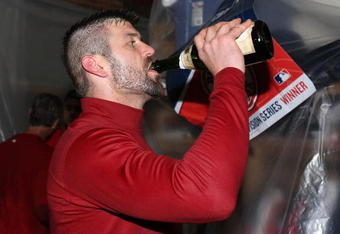 BOSTON - OCTOBER 06:  Jason Varitek #33 of the Boston Red Sox celebrates in the clubhouse after the Red Sox scored a run in the bottom of the ninth inning to win Game Four of the American League Championship Series on October 6, 2008  at Fenway Park in Boston, Massachusetts. The Red Sox defeated the Angels 3-2 to advance to the ALCS.  (Photo by Elsa/Getty Images)