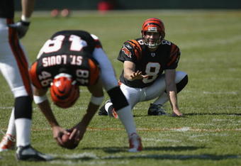 CINCINNATI - SEPTEMBER 29:  Kick holder Nick Harris #8 of the Cincinnati Bengals looks to receive the football from teammate long snapper Brad St. Louis #48 during warms ups before the game against the Tampa Bay Buccaneers on September 29, 2002 at Paul Brown Stadium in Cincinnati, Ohio.  The Buccaneers defeated the Bengals 35-7.  (Photo by Tom Pidgeon/Getty Images)