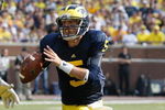 ANN ARBOR, MI - SEPTEMBER 5:  Tate Forcier #5 of the Michigan Wolverines rolls out during the game against the Western Michigan Broncos on September 5, 2009 at Michigan Stadium in Ann Arbor, Michigan. (Photo by Gregory Shamus/Getty Images) 