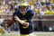 ANN ARBOR, MI - SEPTEMBER 5:  Tate Forcier #5 of the Michigan Wolverines rolls out during the game against the Western Michigan Broncos on September 5, 2009 at Michigan Stadium in Ann Arbor, Michigan. (Photo by Gregory Shamus/Getty Images) 