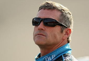 FONTANA, CA - OCTOBER 09:  Bobby Labonte, driver of the #96 DLP Ford, stand on pit road during qualifying for the NASCAR Sprint Cup Series Pepsi 500 at Auto Club Speedway on October 9, 2009 in Fontana, California.  (Photo by Stephen Dunn/Getty Images)