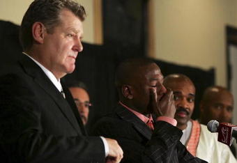 LAS VEGAS - NOVEMBER 04:  Promoter Dan Goosen (L) and Leonard Ellerbe (R) look on as Floyd Mayweather Jr. cries during a post-fight news conference after defeating Carlos Baldomir of Argentina to claim the WBC welterweight championship at the Mandalay Bay Events Center November 4, 2006 in Las Vegas, Nevada. Mayweather announced that he will retire after his next fight.  (Photo by Ethan Miller/Getty Images)