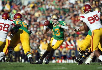 SOUTH BEND, IN - OCTOBER 20: Evan Sharpley #13 of the Notre Dame Fighting Irish runs the ball during the game against the University of Southern California Trojans at Notre Dame Stadium October 20, 2007 in South Bend, Indiana. USC defeated Notre Dame 38-0. (Photo by Jonathan Daniel/Getty Images)