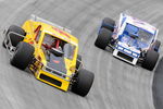 BRISTOL, TN - AUGUST 19:  Donny Lia driver of the #4 Mystic Missile Dodge race with Richard Savary driver of the #21 Alloy Wheel Repair Chevrolet duirng the NASCAR Whelen Modified Tour at Bristol Motor Speedway on August 19, 2009 in Bristol, Tennessee.  (Photo by John Harrelson/Getty Images for NASCAR)
