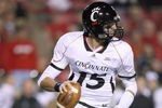 LOUISVILLE, KY - NOVEMBER 14:  Quarterback Tony Pike #15 of the Cincinnati Bearcats runs to pass the ball during the Big East Conference game against the Louisville Cardinals on November 14, 2008 at  Papa John's Stadium in Louisville, Kentucky.  (Photo by Andy Lyons/Getty Images)