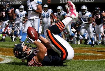 CHICAGO - OCTOBER 04: Greg Olsen #82 of the Chicago Bears catches a touchdown pass against the Detroit Lions on October 4, 2009 at Soldier Field in Chicago, Illinois. The Bears defeated the Lions 48-24. (Photo by Jonathan Daniel/Getty Images)