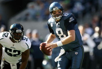 SEATTLE - OCTOBER 11:  Quarterback Matt Hasselbeck #8 of the Seattle Seahawks scrambles against linebacker Daryl Smith #52 of the Jacksonville Jaguars on October 11, 2009 at Qwest Field in Seattle, Washington. The Seahawks defeated the Jaguars 41-0. (Photo by Otto Greule Jr/Getty Images)